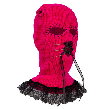 Pink knitted balaclava with black lace trim on a white background
