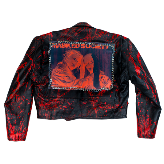 Black leather jacket with red splatter design and 'Masked Society' patch on a white background