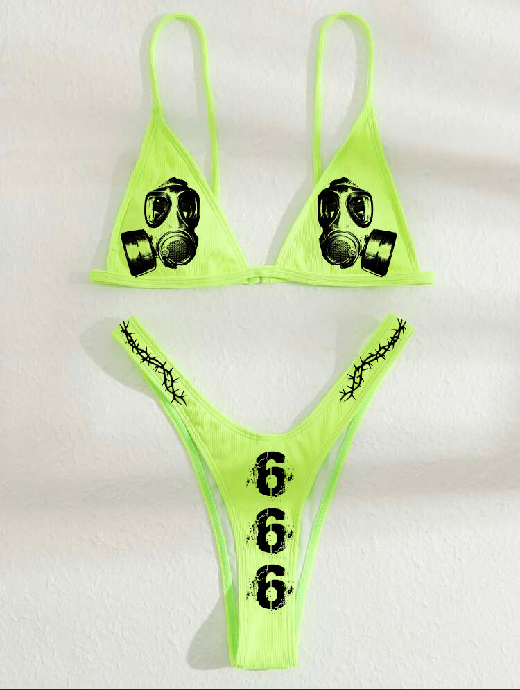 Neon green bikini set with black gas mask and thorn designs on a white background