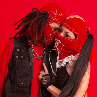 Two people couple in red ski mask