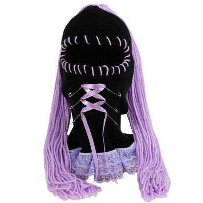 Black ski mask with lavender lace and purple hair extensions on a mannequin head against a white background
