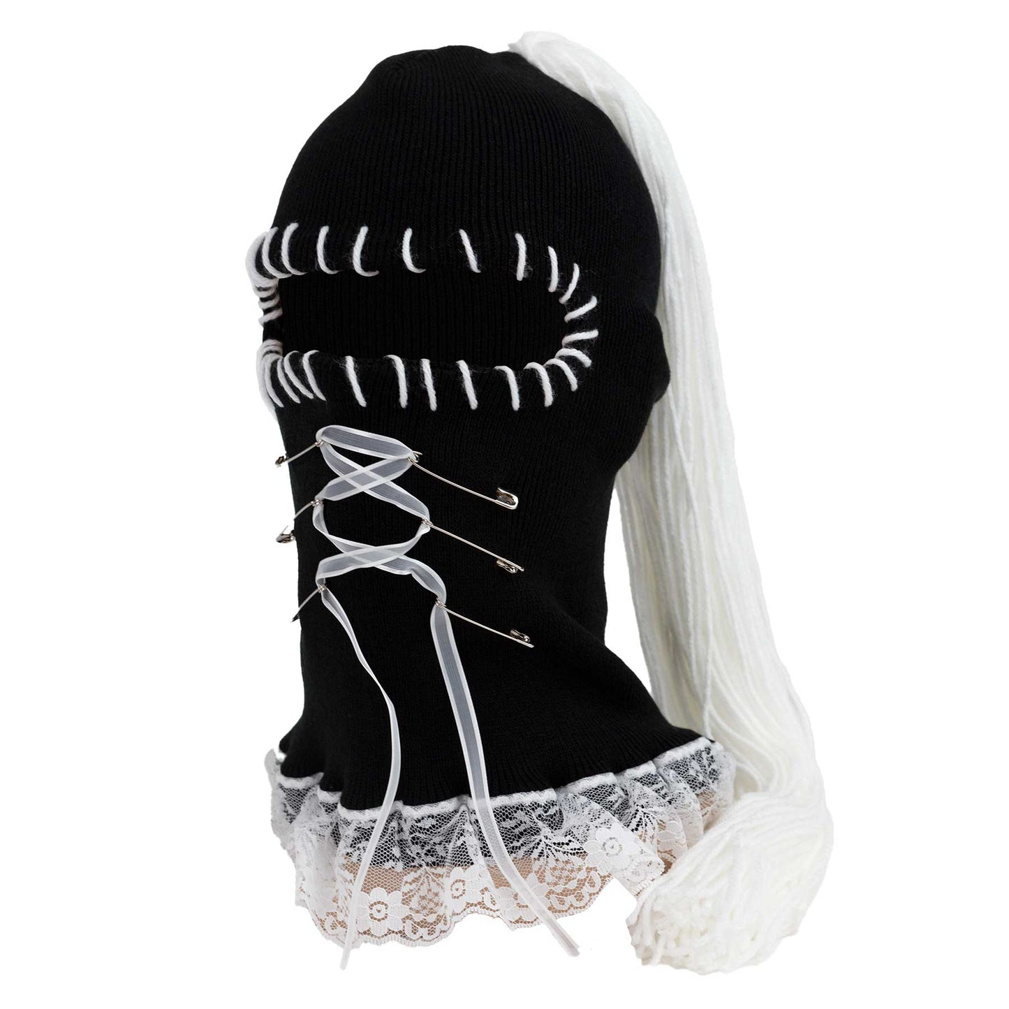 Black beanie with white lace and ribbons on a white background