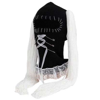 Black and white ski mask with lace details on a white background