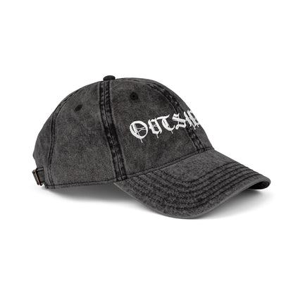 Black denim cap with 'OUTSIDER' embroidery on a white background