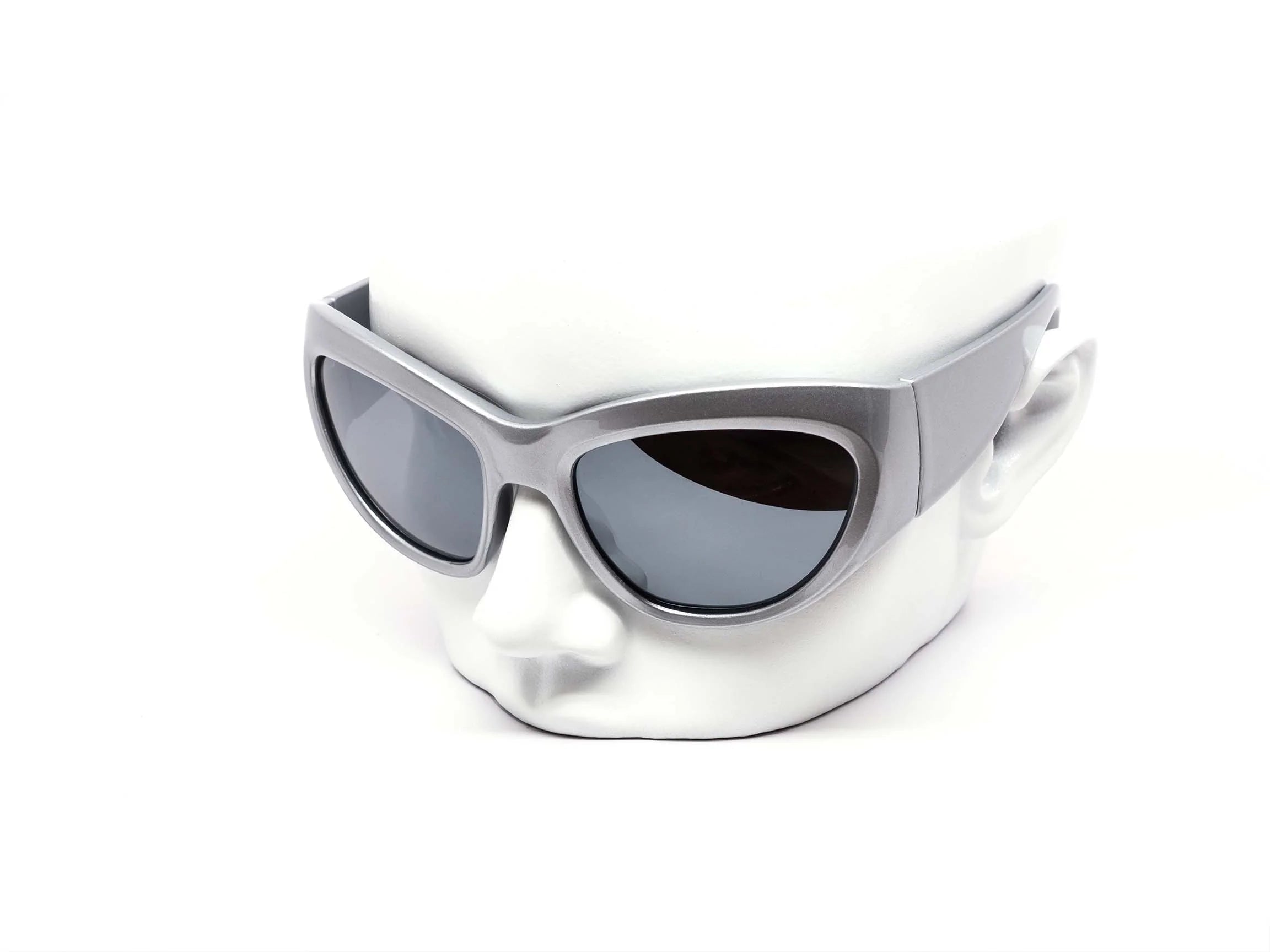 Silver sunglasses with dark lenses on a white background