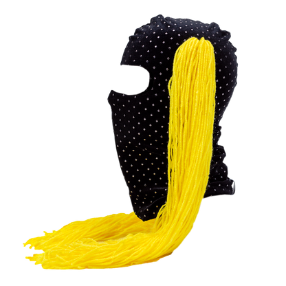 Black mask with yellow hair extensions on a white background