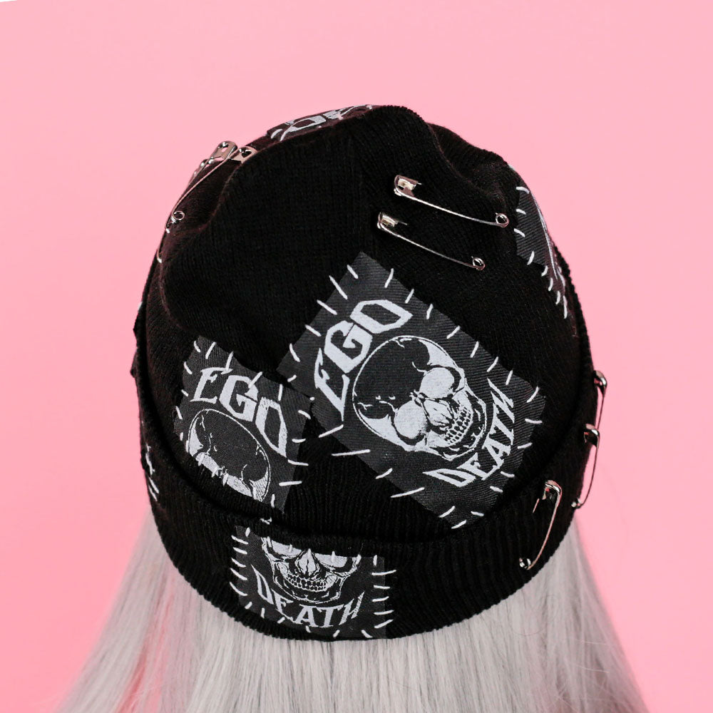 Black beanie with skull and patches