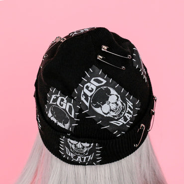 Black beanie with skull and patches