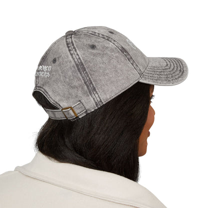 Person wearing a gray denim cap with 'Borco Outfitters' branding on a white background