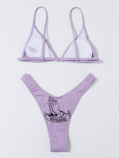 Purple bikini set with graphic design on a white background