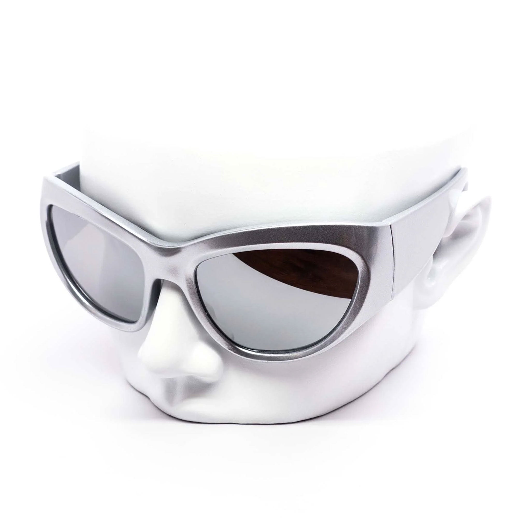 Silver sunglasses on a white mannequin head with a white background