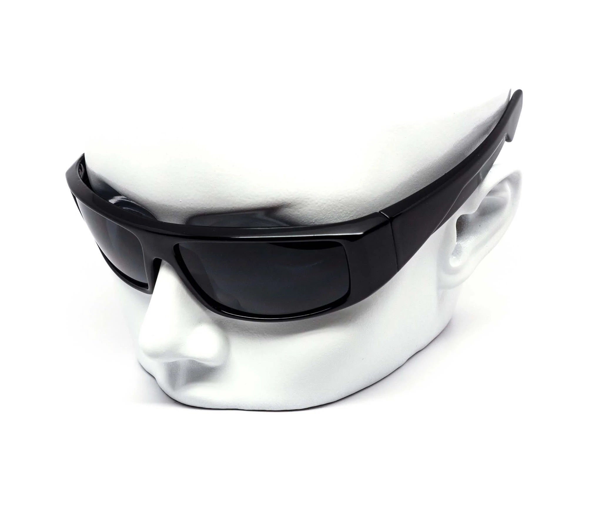 Black sunglasses on a white mannequin head against a white background