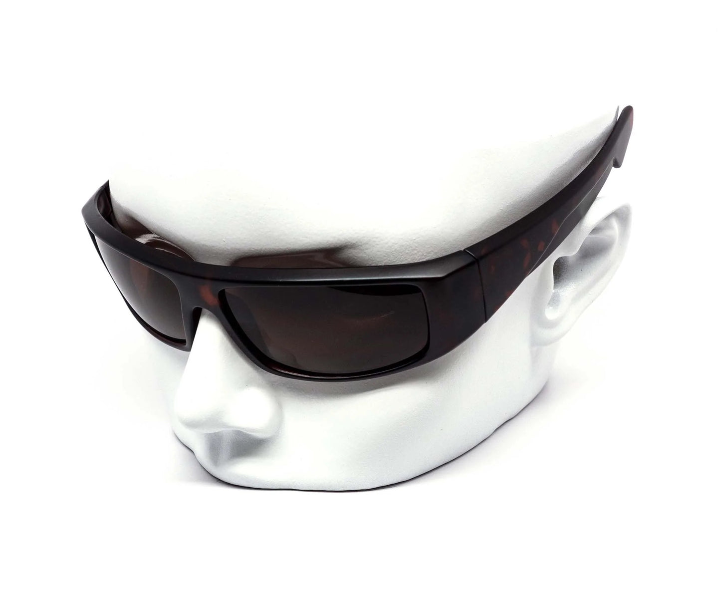 Sunglasses on a white mannequin head against a white background
